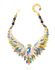 Statement peacock necklace featuring hand painted enamel feathers, multicolored crystal accents, gold tone detailing, and a sculptural peacock centerpiece.