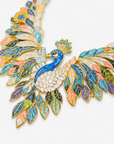 Multicolor peacock statement necklace featuring sculpted feathers in turquoise, green, purple, coral, ivory and gold.