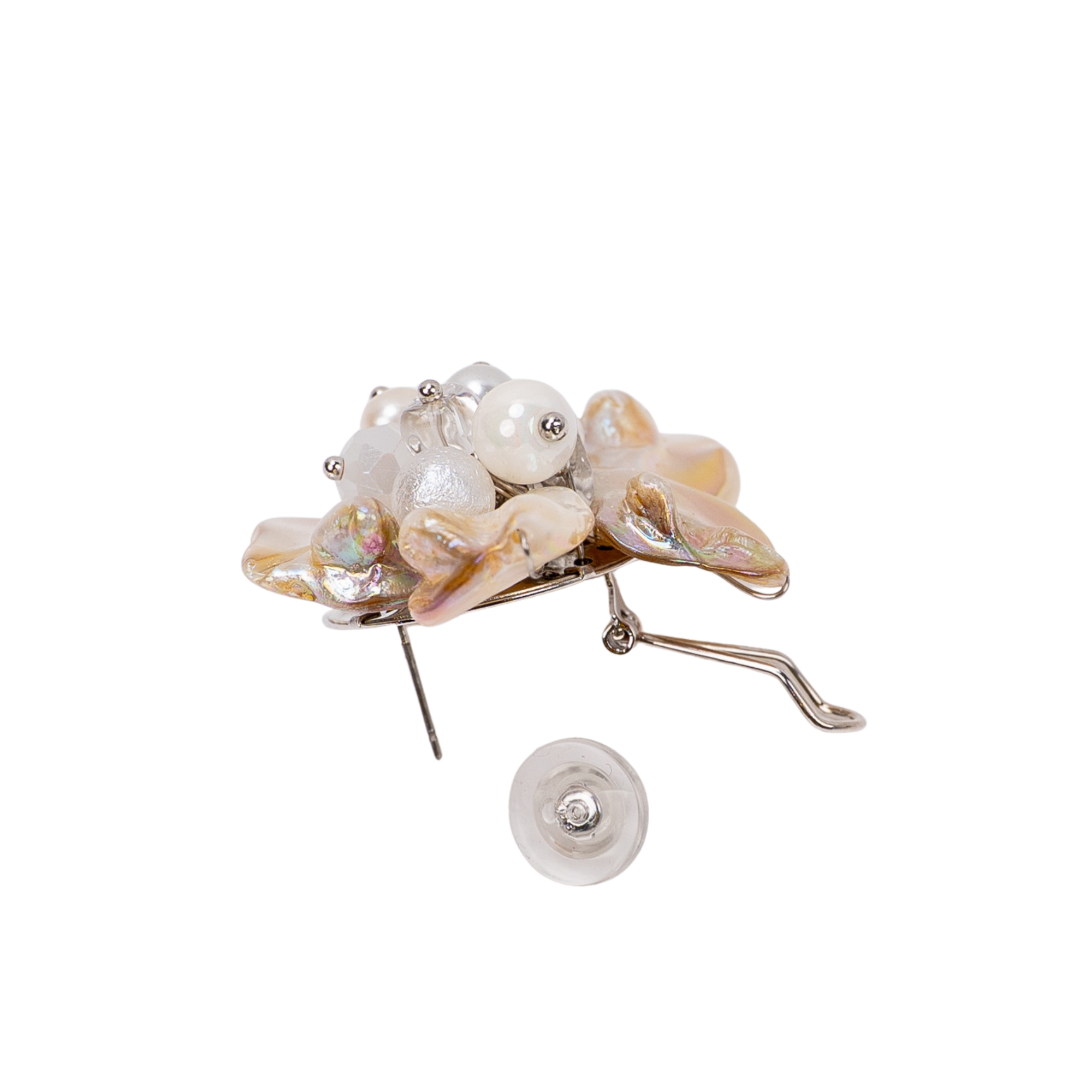 Mother of pearl floral statement earrings with pearl cluster center inspired by wisteria blossoms worn on a woman's ear