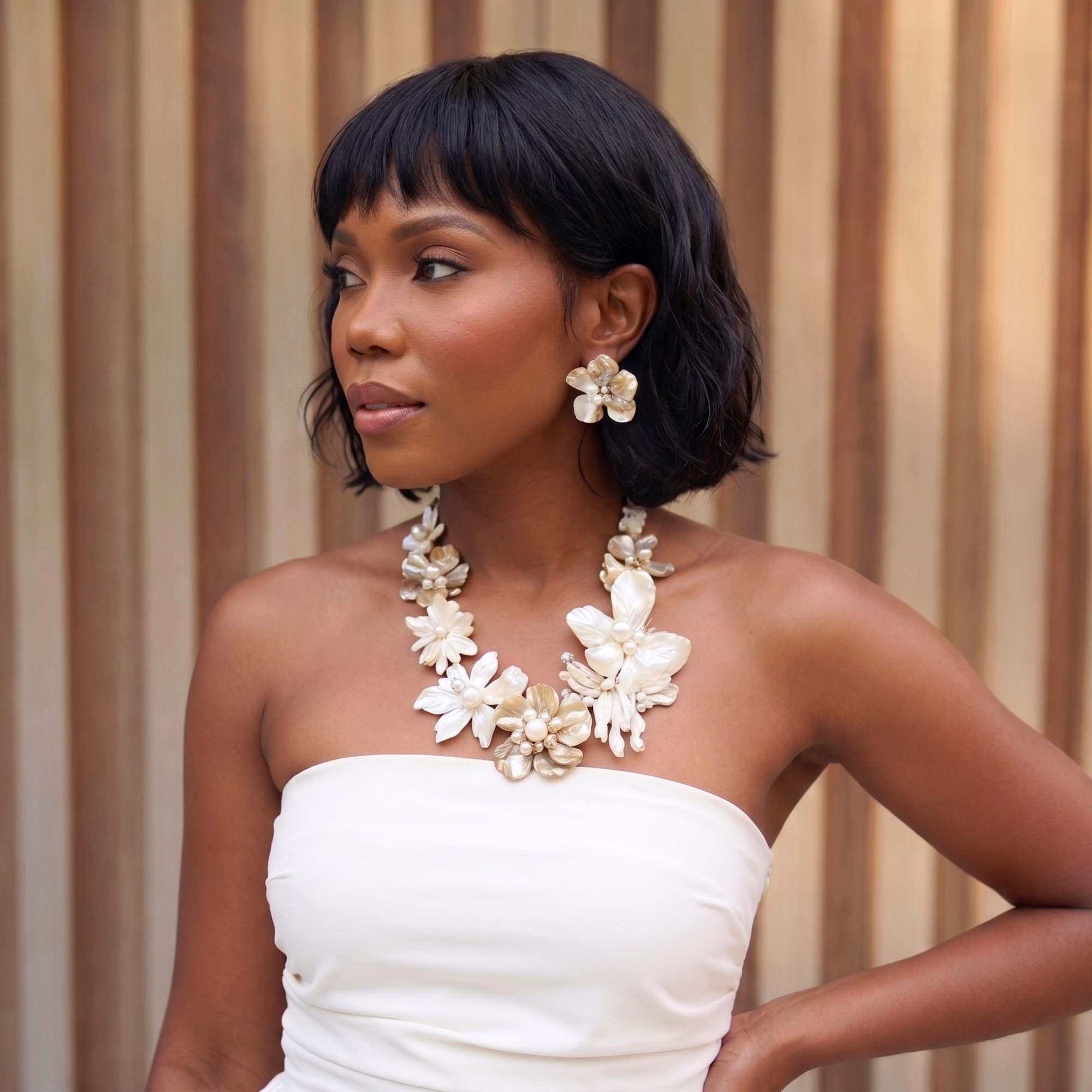 Statement necklace handcrafted from Mother of Pearl flowers, freshwater cultured pearls, Czech AB crystal accents, and sculptural floral detailing.