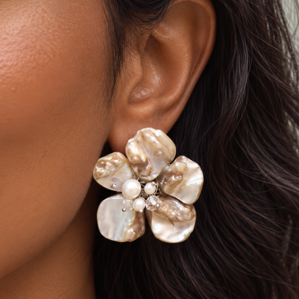 Ivory floral statement earrings featuring sculptural Mother of Pearl petals with pearl and clear faceted bead details.