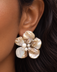 Ivory floral statement earrings featuring sculptural Mother of Pearl petals with pearl and clear faceted bead details.