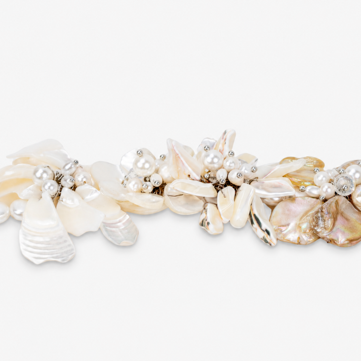 Mother of Pearl floral statement bracelet with luminous shell petals and dimensional pearl clusters.