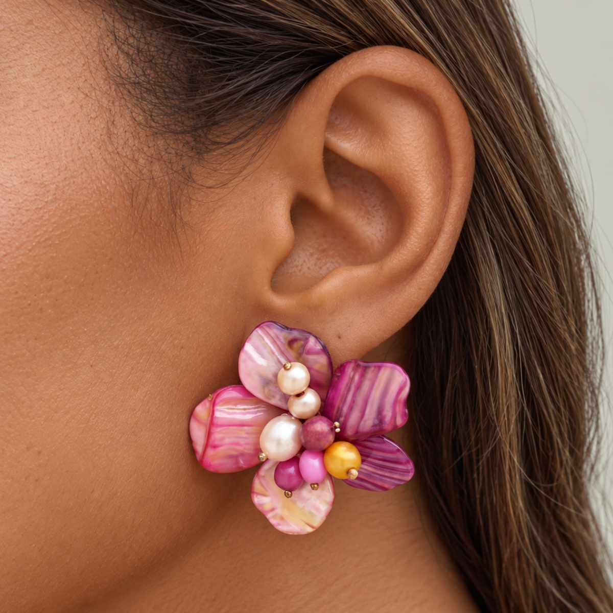 Colorful floral dangle earrings featuring iridescent abalone shell flowers with freshwater cultured pearls and sparkling glass bead centers.
