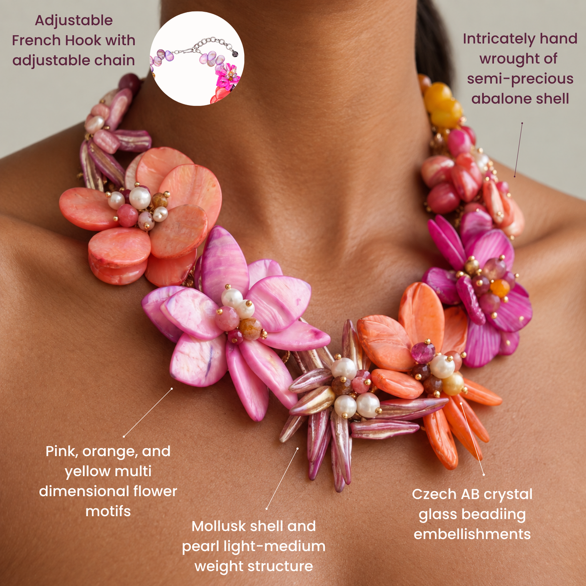 Close up of Wisteria necklace featuring sculptural pink, coral, orange and magenta abalone shell flowers with luminous pearls.