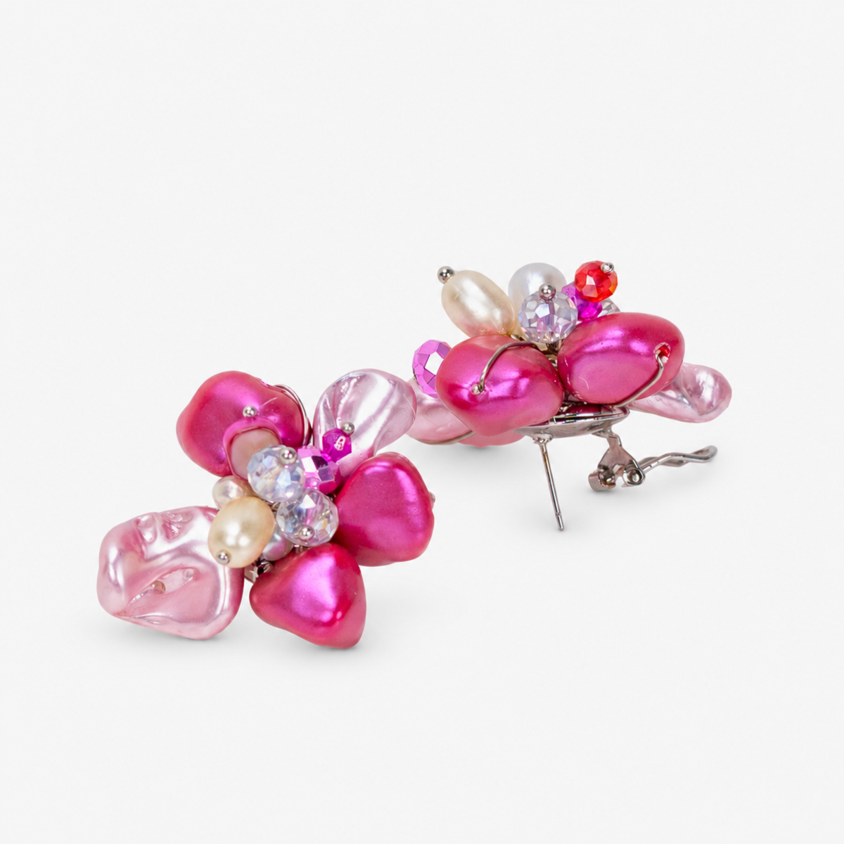 Pink and orange floral statement earrings featuring laser cut abalone shell petals and genuine freshwater cultured pearl accents.