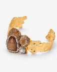 Cognac statement cuff featuring warm brown stones, a pearl accent and textured Gold tone finish.