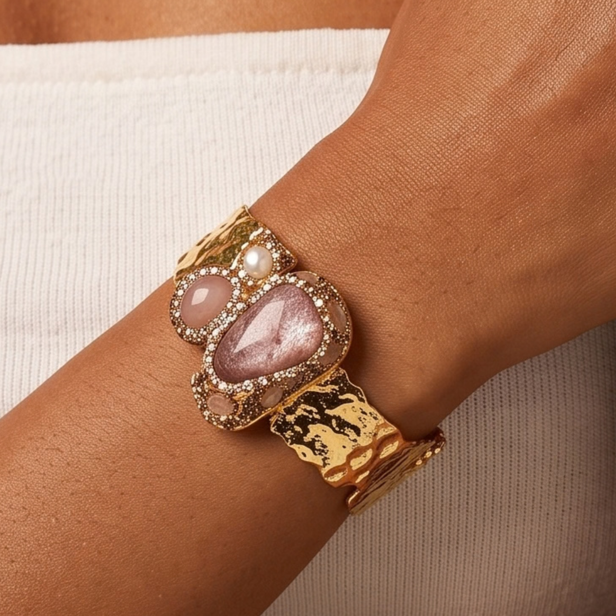 Sassy Jones Zahara Rose cuff featuring a large blush stone centerpiece with dimensional crystal embellishments.