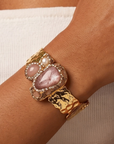 Sassy Jones Zahara Rose cuff featuring a large blush stone centerpiece with dimensional crystal embellishments.