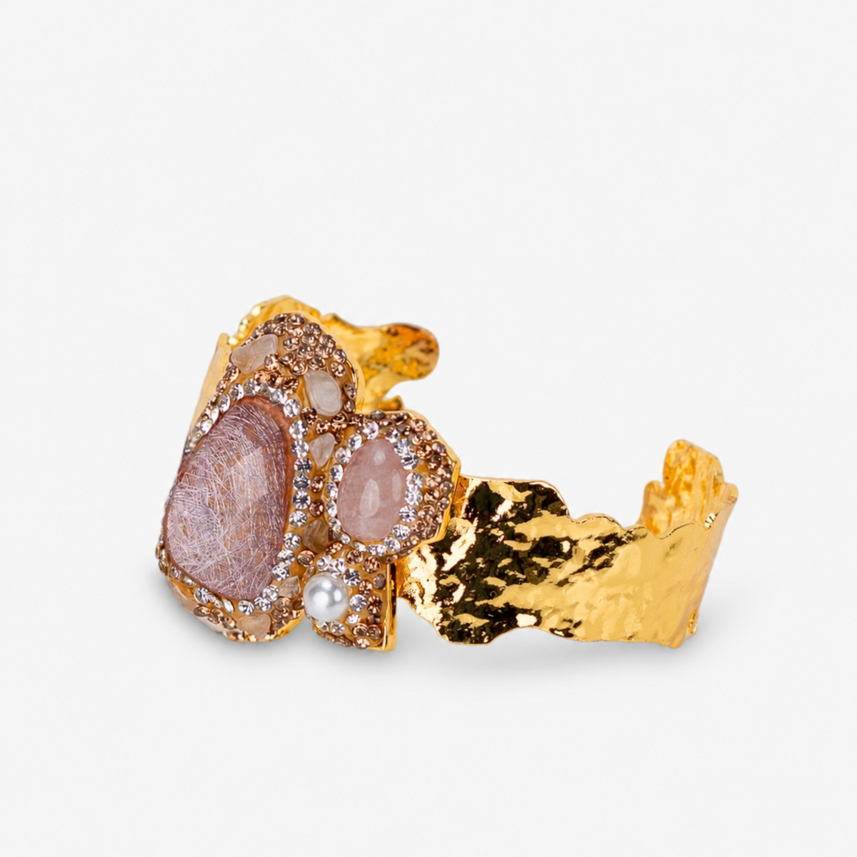 Rose statement cuff featuring soft pink stones, a pearl accent and textured Gold tone finish.
