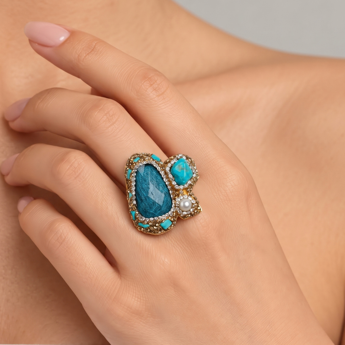 Sassy Jones Zahara Sparkle Ring featuring an oversized deep blue stone surrounded by dimensional teal accents.