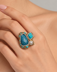 Sassy Jones Zahara Sparkle Ring featuring an oversized deep blue stone surrounded by dimensional teal accents.