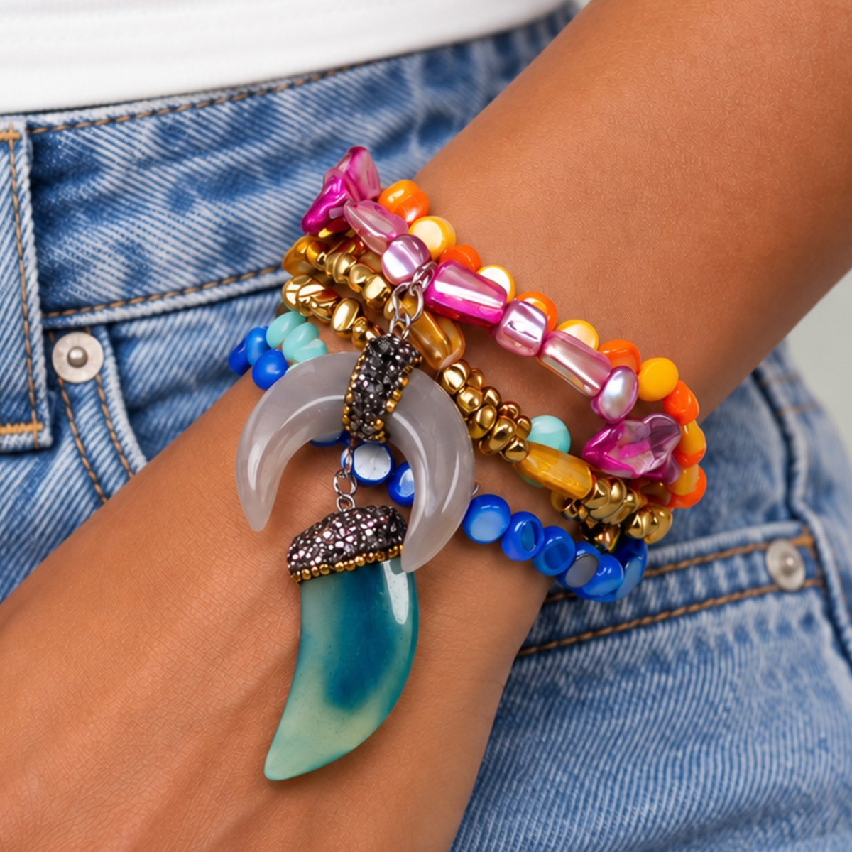 Colorful five piece stretch bracelet set featuring layered shell beads, metallic gold accents, and two dimensional shell charms.