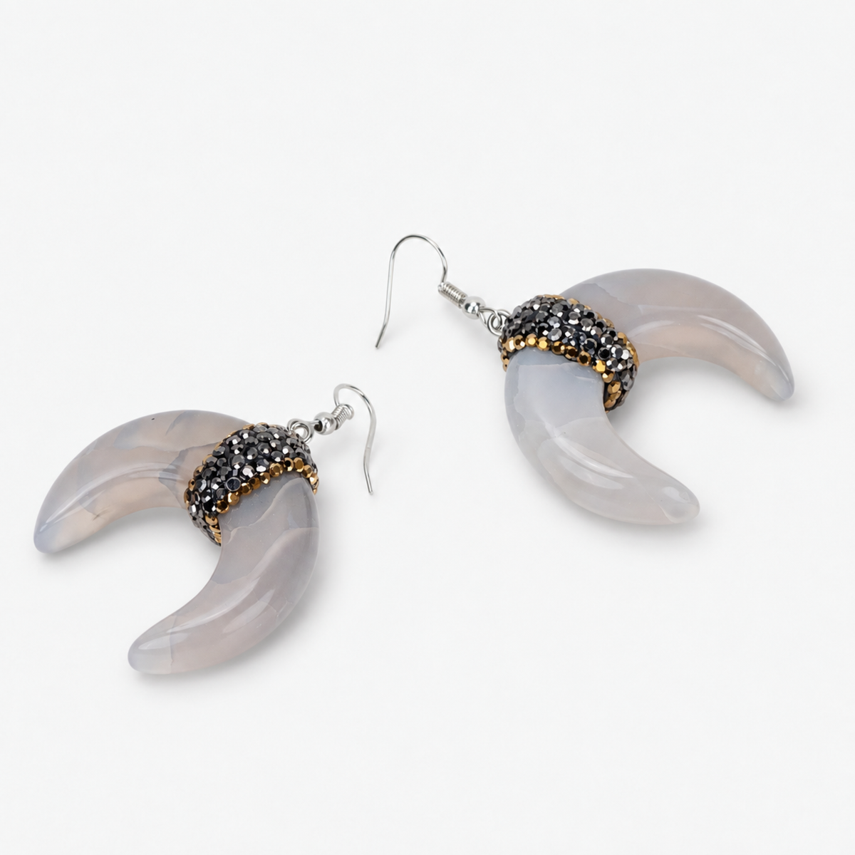 Natural shell crescent earrings with translucent ivory and gray marbling and crystal embellished accents.