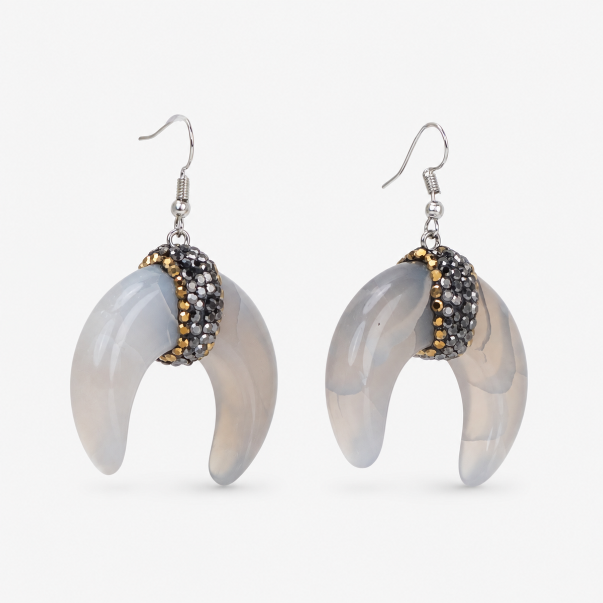 Close-up of Zuma Natural Shell Crystal Crescent Dangles with softly marbled shell and dimensional sparkling centers. 

Zuma crescent dangle earrings featuring organic shell variation, crystal detailing, and delicate hook ear wires.