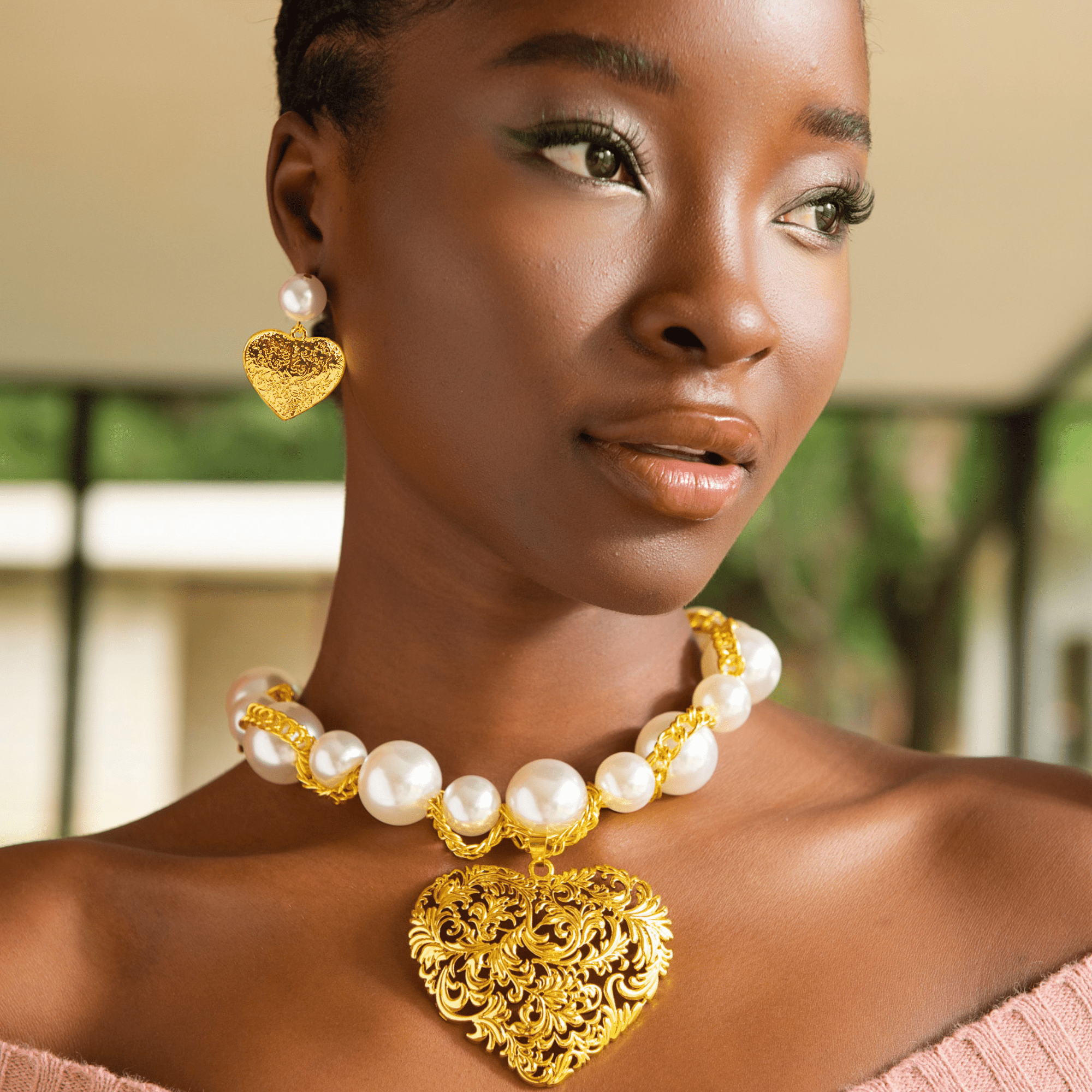 Model wearing Amora Chunky Pearl Heart Chain with matching earrings – Sassy Jones jewelry.