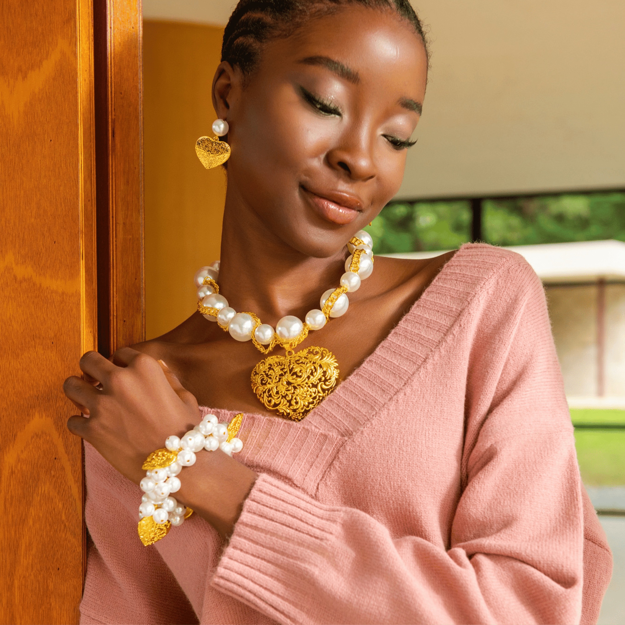Amora Collection bracelet paired with matching pearl necklace and earrings.
