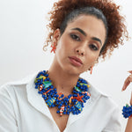 Caicos Bib - Sassy Jones, 4 strand design -Collar-length bib  -13 removable hand-painted resin-filled sea creature brooches with single-back prongs -Multi-faceted cobalt blue teardrop resin beads -Colorful seed bead spacer beads