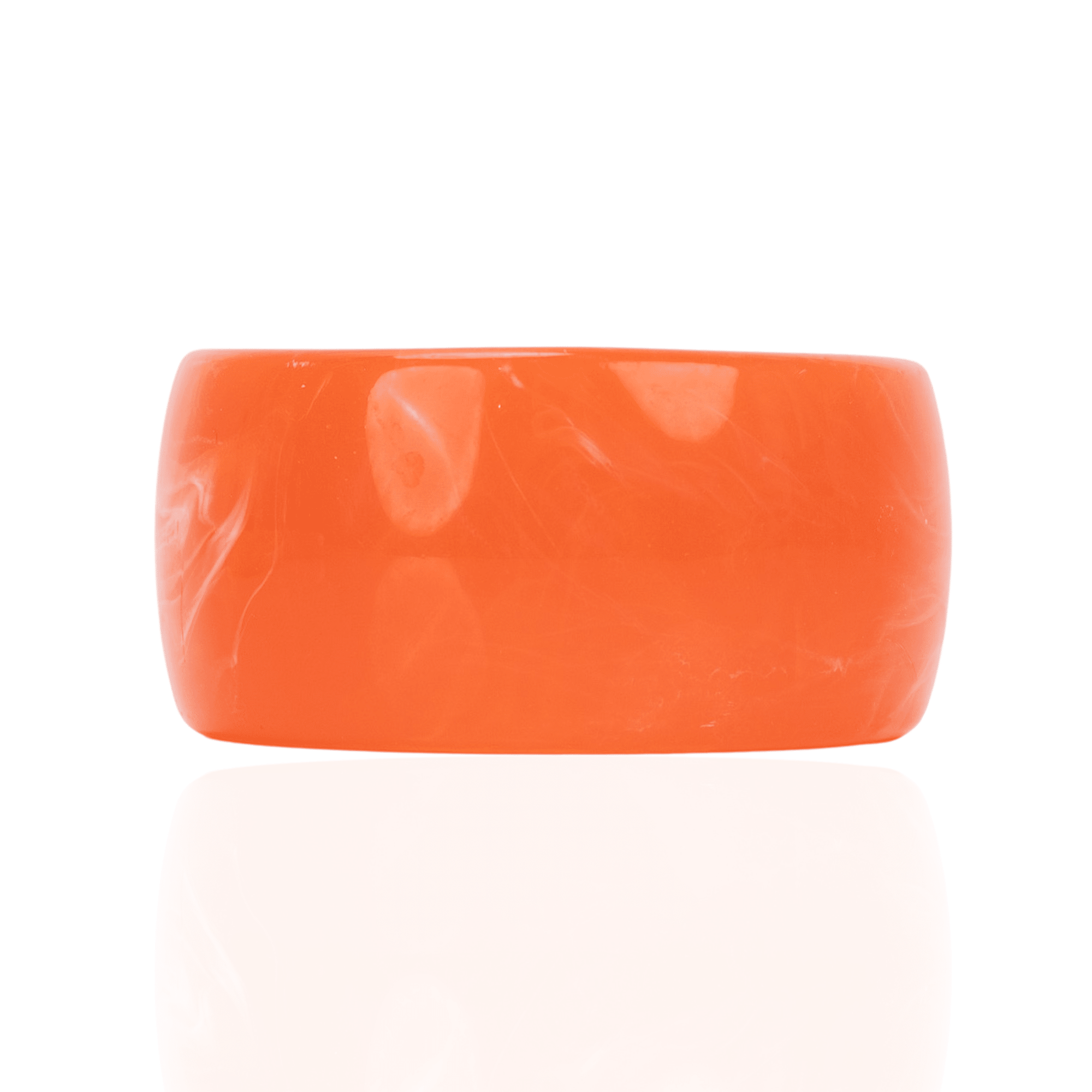 Chunky coral orange resin bangle bracelet with glossy translucent marbling on a white background.