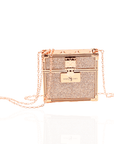 Luxury red lipstick trio with three velvety matte red shades and glittering gold clutch case with chain strap