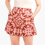 Bold print shorts High-fashion designer shorts Artistic print shorts Creative design shorts Stylish maroon shorts Modern chic shorts