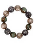 Oversized marbled stretch bracelet with glossy resin beads in olive, caramel, espresso, and smoky plum tones on a white background.