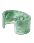 Wide seafoam green marbled resin cuff bracelet with glossy finish on a clean white background.