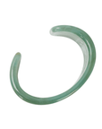 Wide seafoam green marbled resin cuff bracelet with glossy finish on a clean white background.