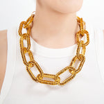 Kerri Chain - Gold - Sassy Jones - -Oversized interlocking chain links -Inlaid with golden Colorado topaz crystals -Matte gold metal hardware -6-inch extender and easy hook closure