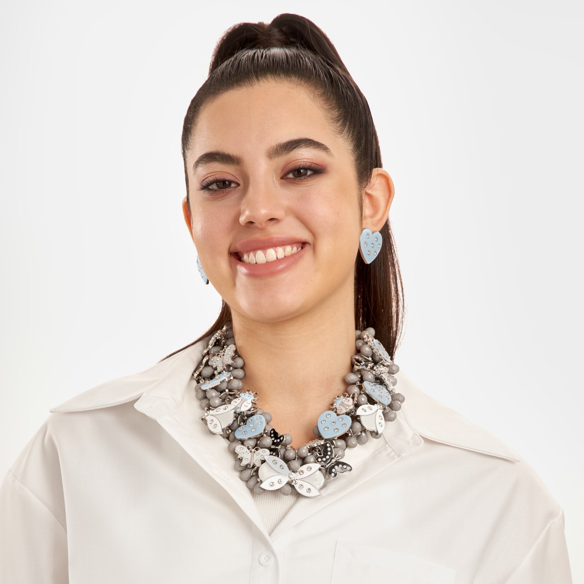 Lovebug Greige Jewelry Unique Beaded Necklace Grey Statement Necklace Heart Shaped Earrings Fashionable Greige Jewelry Designer Lovebug Necklace Trendy Grey Accessories Artistic Statement Jewelry Beaded Lovebug Jewelry Set Elegant Grey Fashion Jewelry High Fashion Beaded Necklace