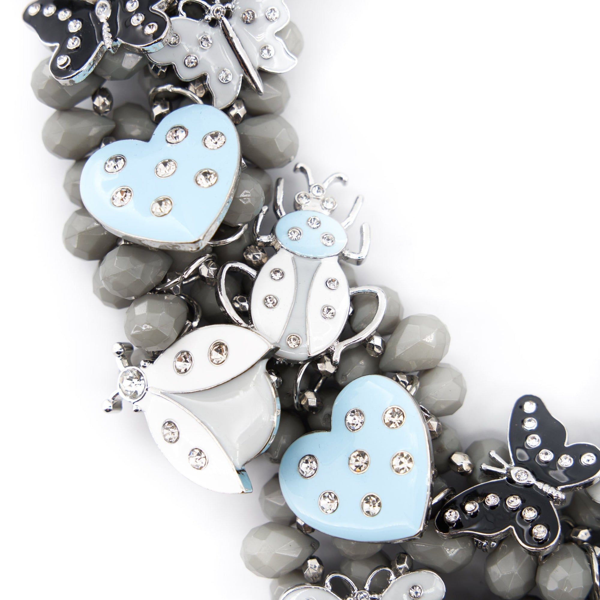 Lovebug Greige Jewelry Unique Beaded Necklace Grey Statement Necklace Heart Shaped Earrings Fashionable Greige Jewelry Designer Lovebug Necklace Trendy Grey Accessories Artistic Statement Jewelry Beaded Lovebug Jewelry Set Elegant Grey Fashion Jewelry High Fashion Beaded Necklace