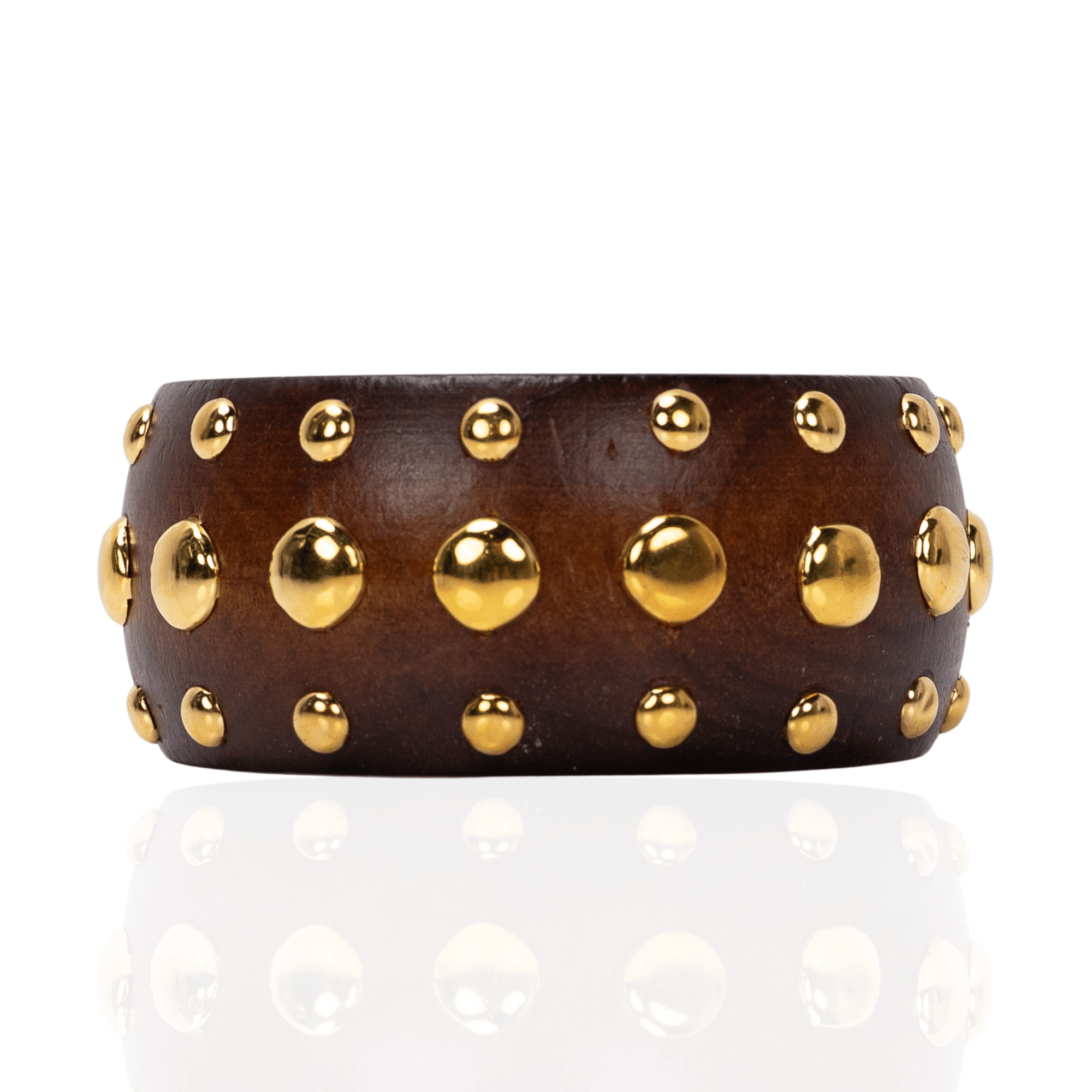 Brown honeywood inspired statement bangle bracelet with gold dome stud embellishments on a white background.
