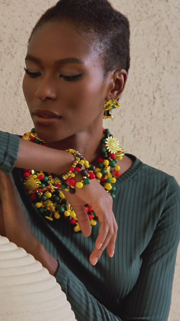 bracelet stack for women, stretch bracelet set, African inspired jewelry, bold beaded bracelets, cultural bracelet stack, statement bracelets for women, artisan bracelet collection, red green gold jewelry, luxury fashion bracelets, boutique bracelet stack