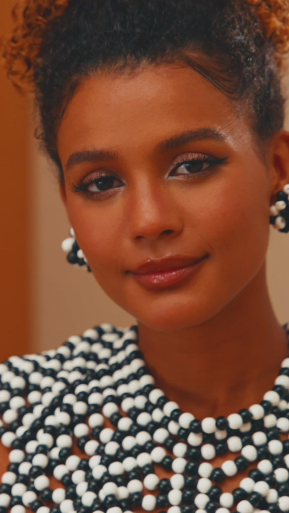 Ayoka earrings, black and white beaded earrings, wooden clip-on earrings, monochrome jewelry, handcrafted statement earrings, bold beaded earrings, lightweight wooden earrings, black and white statement jewelry, jazzy beaded earrings, versatile statement earrings