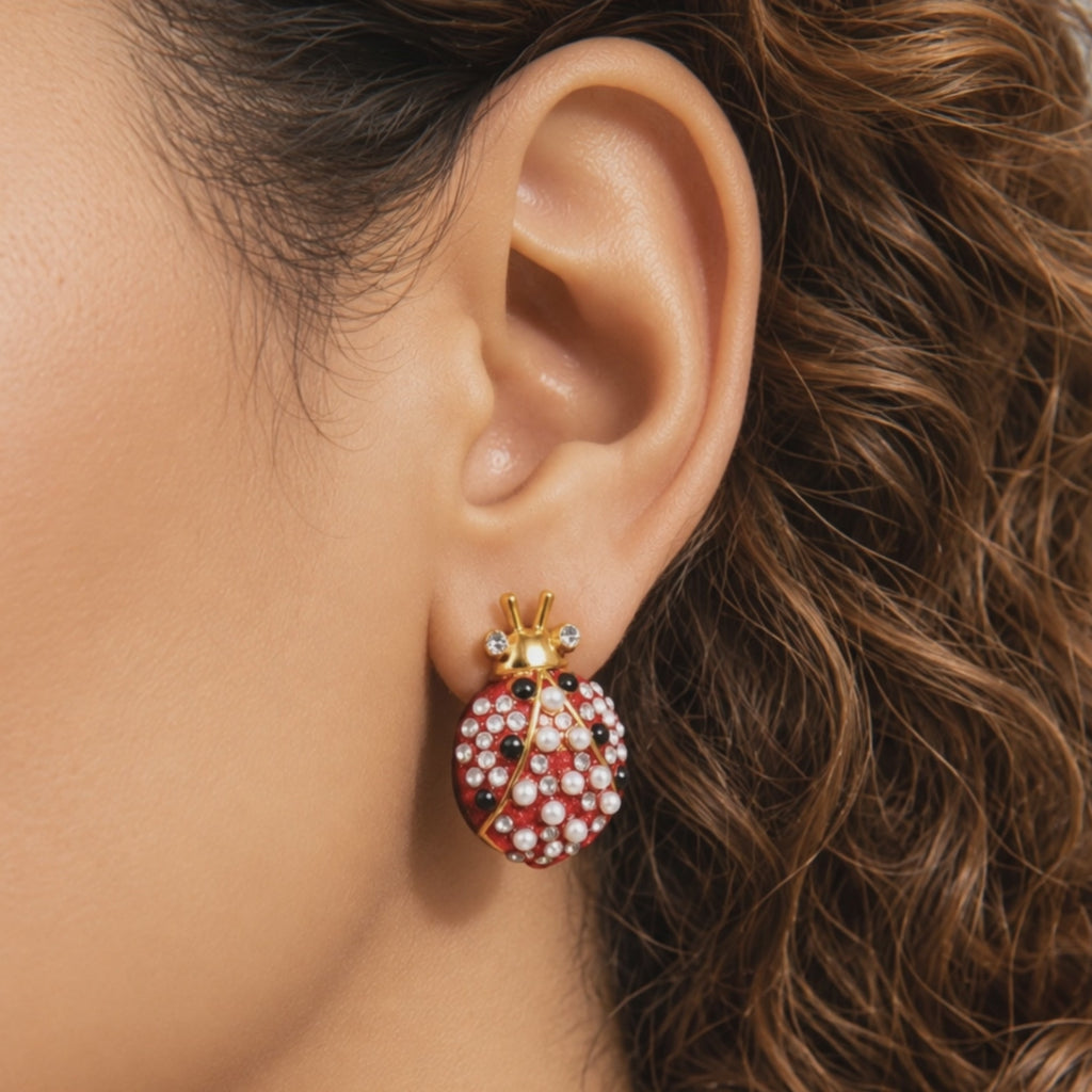 Close up of Scarlette Dainty Pearl Stud showing a jeweled red ladybug with pearl covered wings and crystal tipped antennae.