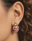 Close up of Scarlette Dainty Pearl Stud showing a jeweled red ladybug with pearl covered wings and crystal tipped antennae.