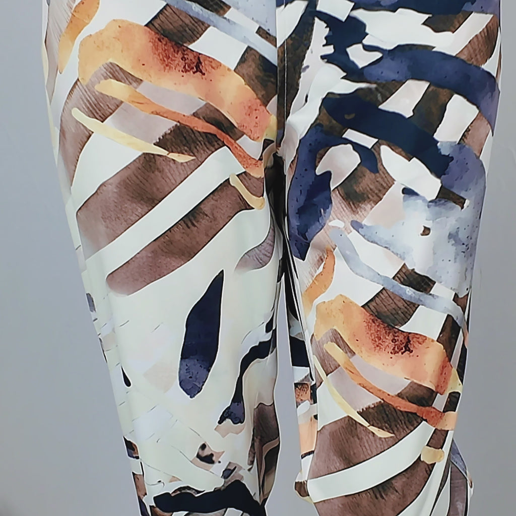 Women's multicolor stretch jogger pant featuring a golden waistband and artistic safari-inspired print.