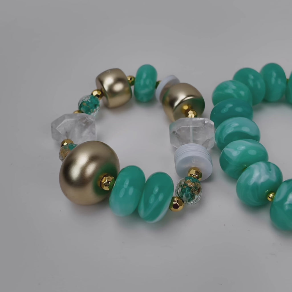 Two piece teal statement bracelet stack featuring chunky marbled beads, clear natural stone and gold accents.
