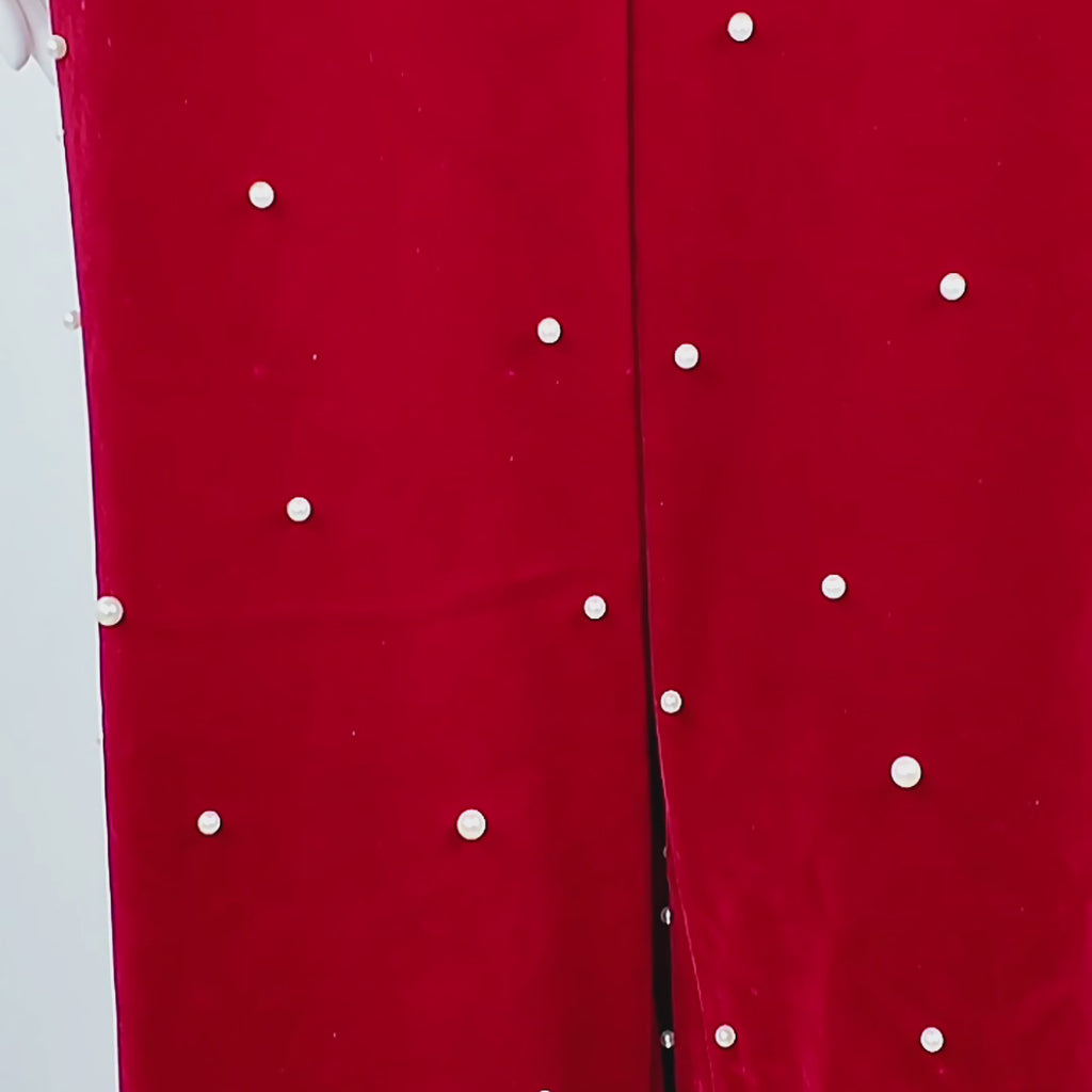 Sassy Jones Fiorella Pant featuring a high-rise waist, tailored pleats, and pearl embellished red velvet.