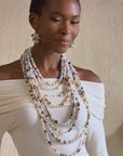 Clustered dangle earrings with natural Botswana agate beads in ivory and neutral tones with gold hook closure.