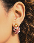 Dainty jeweled ladybug earrings featuring red, black and white detailing with pearls and sparkling crystal accents.