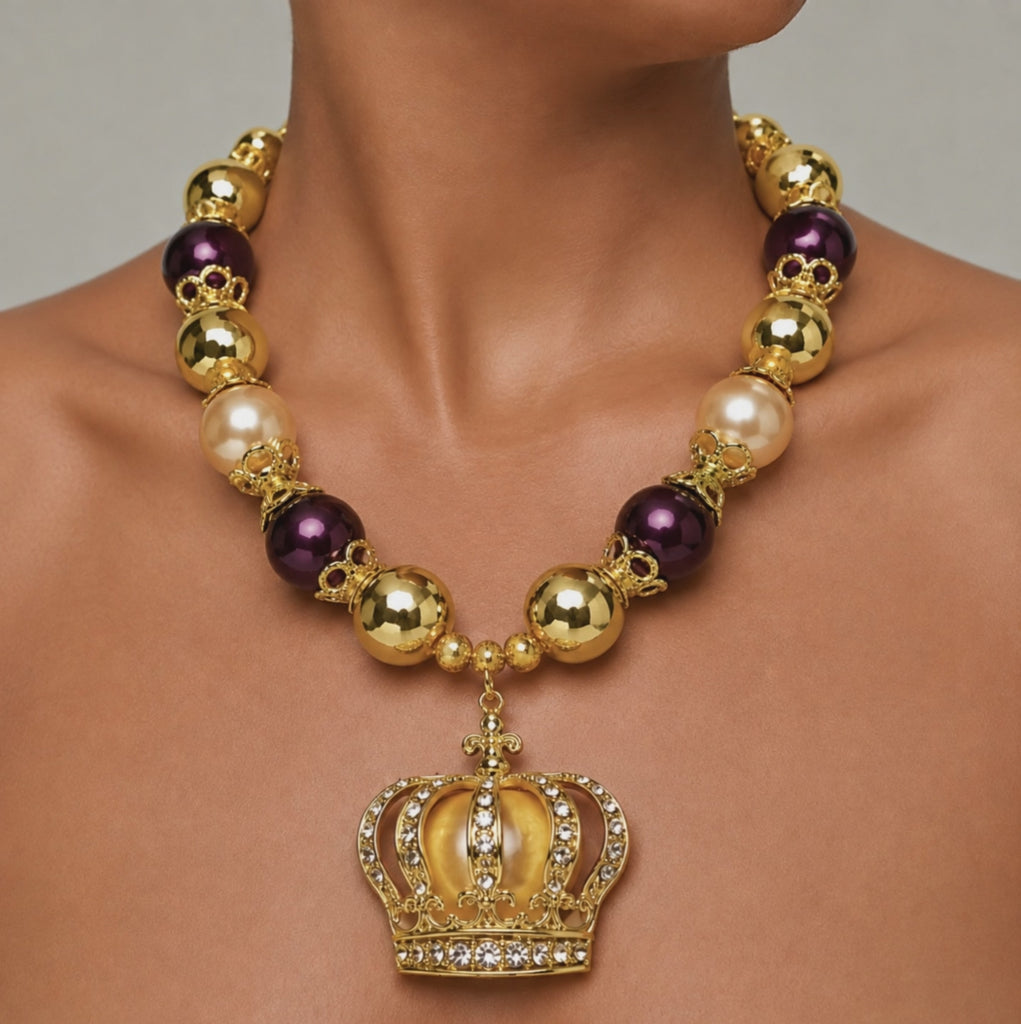 Sassy Jones Reign necklace with champagne pearl beads, metallic gold beads and crystal embellished crown pendant.
