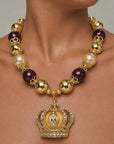 Sassy Jones Reign necklace with champagne pearl beads, metallic gold beads and crystal embellished crown pendant.