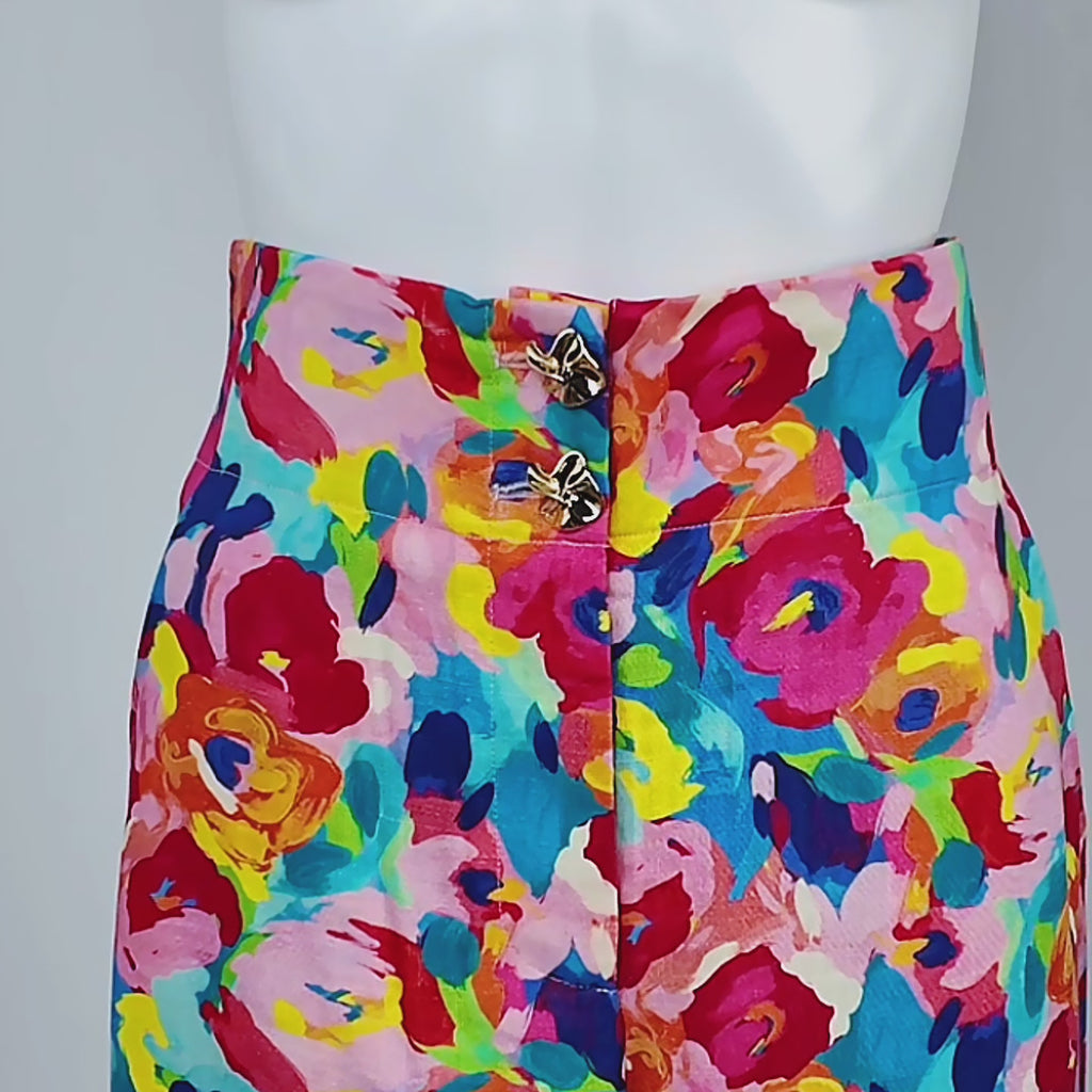 Colorful wide leg linen blend trousers featuring abstract pink, blue, orange, yellow and green florals.