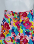 Colorful wide leg linen blend trousers featuring abstract pink, blue, orange, yellow and green florals.