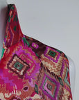 Front view of the Margaux Jacquard Shift Dress featuring a bold jewel toned geometric print.