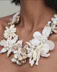 Sassy Jones Wisteria statement necklace with luminous ivory and champagne Mother of Pearl floral details.