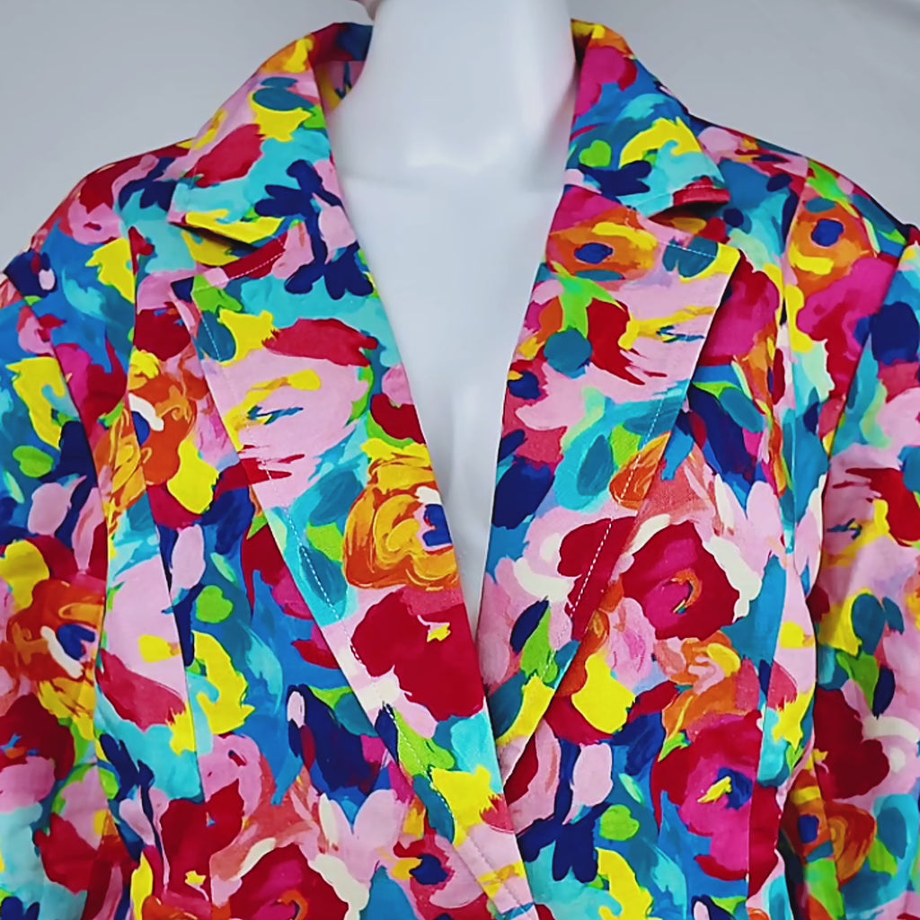 Sassy Jones Summer Garden Blazer with structured shoulders, notched lapels, front pockets, and colorful floral print.