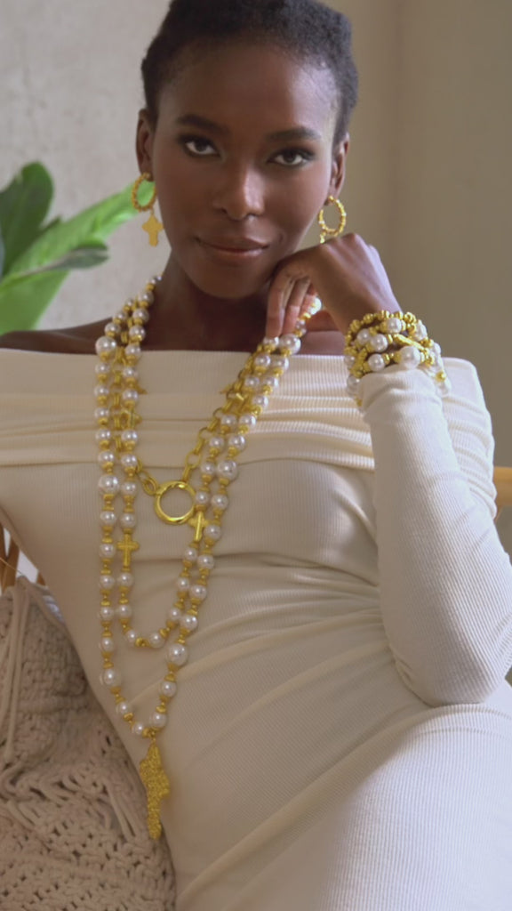 pearl statement necklace, cross pendant necklace, long pearl necklace, layered gold necklace, fashion pearl jewelry, dress chain necklace, luxury statement jewelry, women’s pearl necklace, bold cross necklace, boutique necklaces