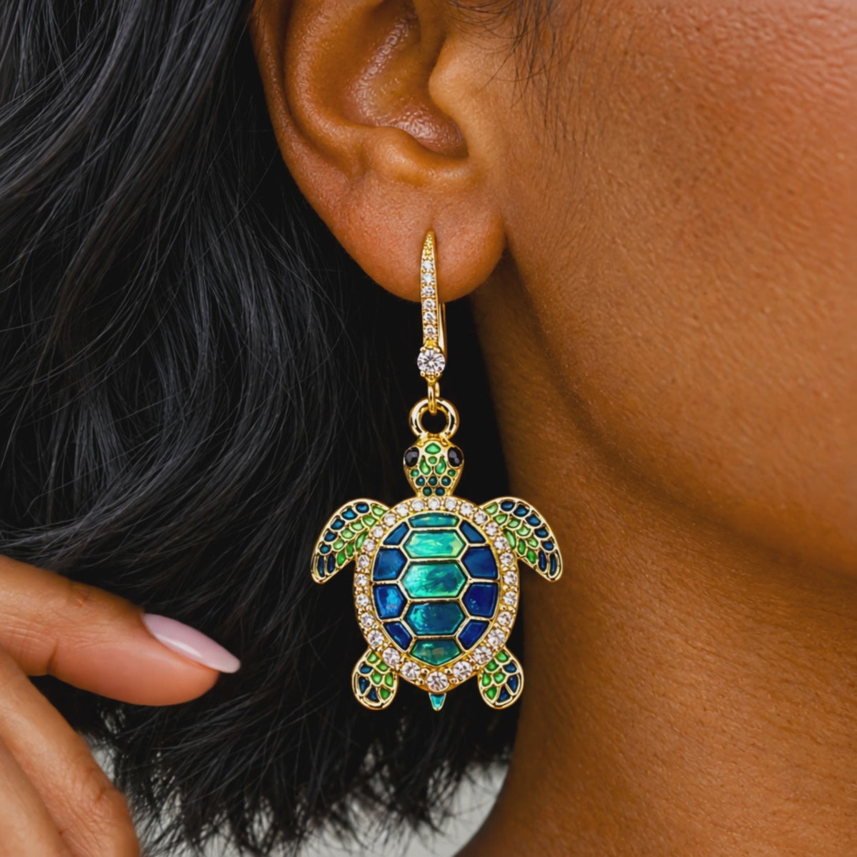Sassy Jones Soleia statement earrings featuring jeweled sea turtle pendants suspended from crystal lined drops.